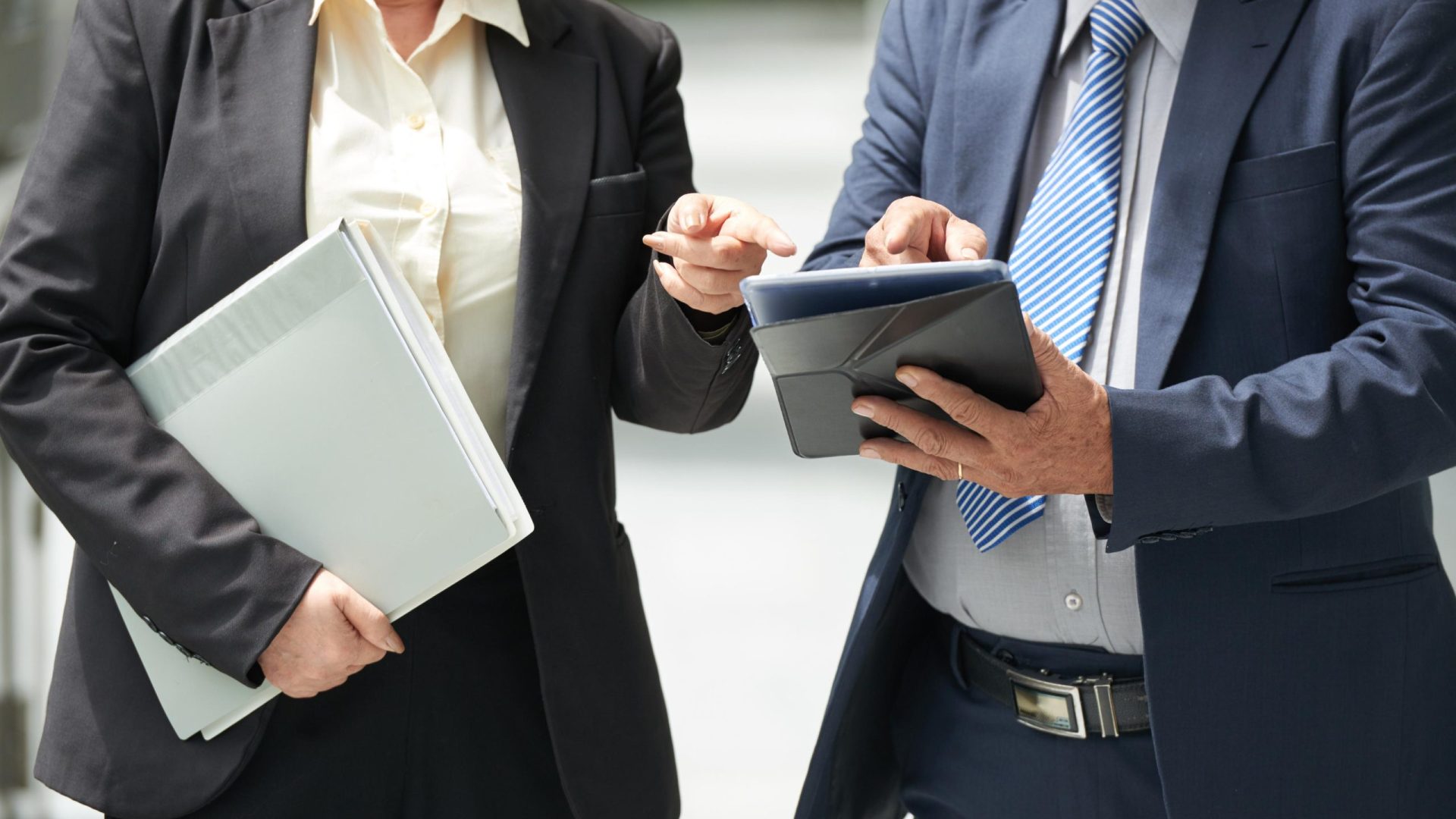 business-professionals-discussing-data-on-tablet-d-2026-01-07-07-10-14-utc business-professionals-discussing-data-on-tablet-d-2026-01-07-07-10-14-utc