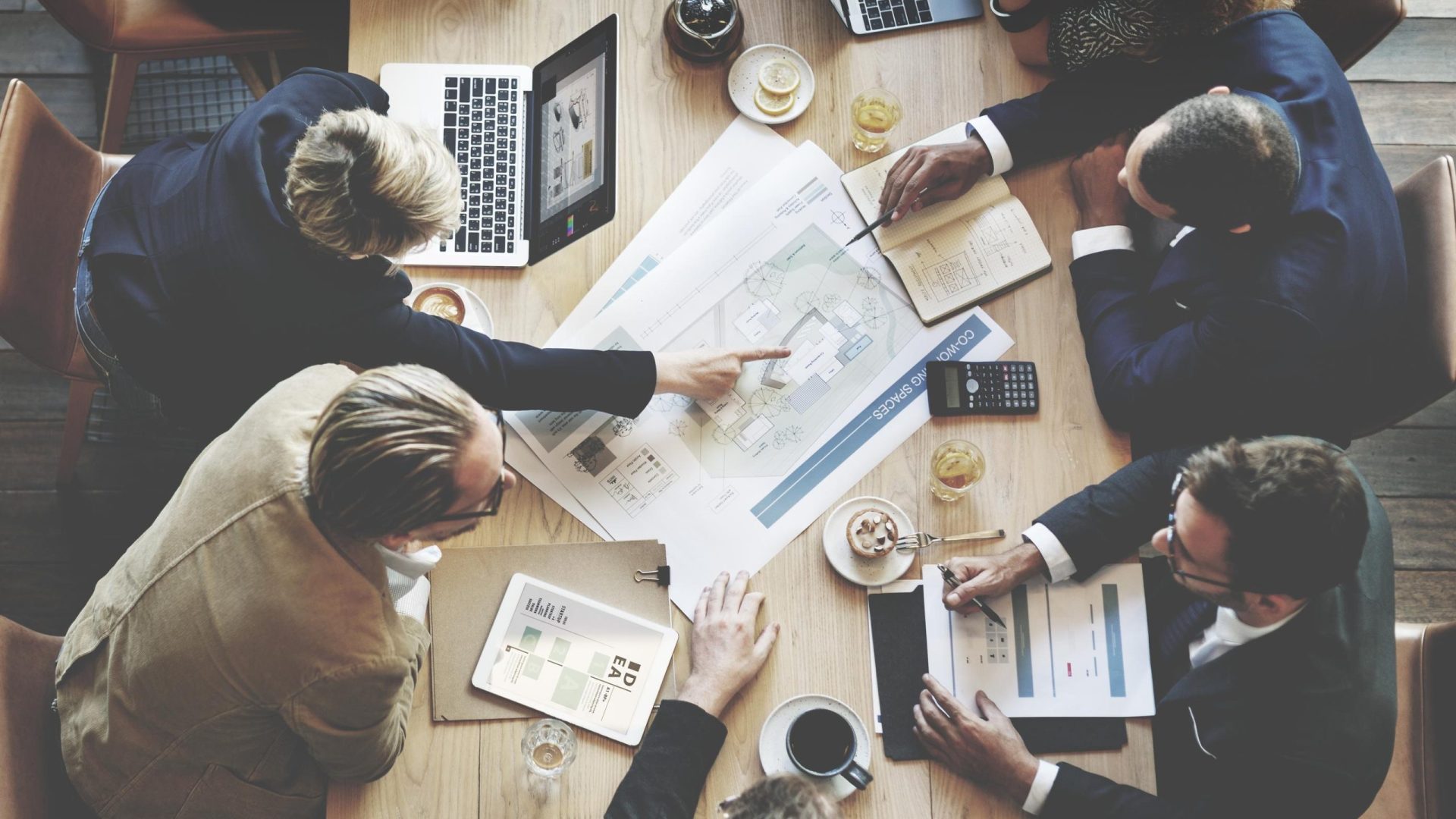 business-team-meeting-around-a-conference-table-2026-09-15-20-18-03-utc business-team-meeting-around-a-conference-table-2026-09-15-20-18-03-utc